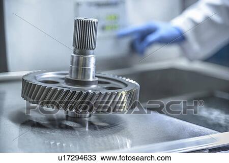 Stock Image - Worker cleaning with ultrasonics. Fotosearch