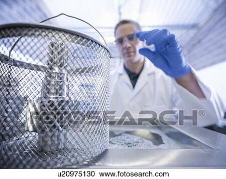 Worker cleaning with ultrasonics View Large Photo Image Stock Image - Worker cleaning with ultrasonics. Fotosearch
