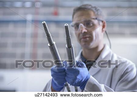 Worker cleaning with ultrasonics View Large Photo Image Stock Image - Worker cleaning with ultrasonics. Fotosearch