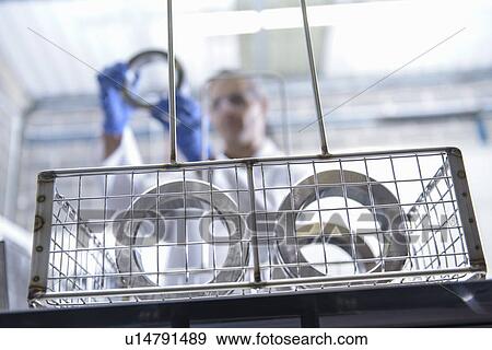 Stock Photo - Worker cleaning with ultrasonics. Fotosearch
