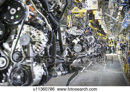 Worker on production line in car factory View Large Photo Image Stock Photograph - Worker on production line in car factory. Fotosearch