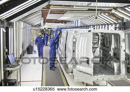 Stock Photography - Workers inspecting cars in factory. Fotosearch