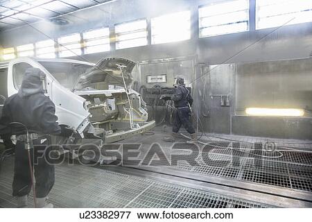 Workers spray painting in car factory View Large Photo Image Stock Photo - Workers spray painting in car factory. Fotosearch