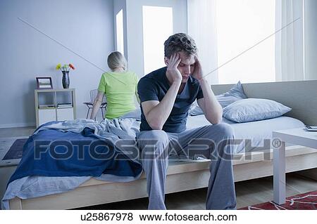 Angry couple sitting on bed View Large Photo Image Stock Photo - Angry couple sitting on bed. Fotosearch