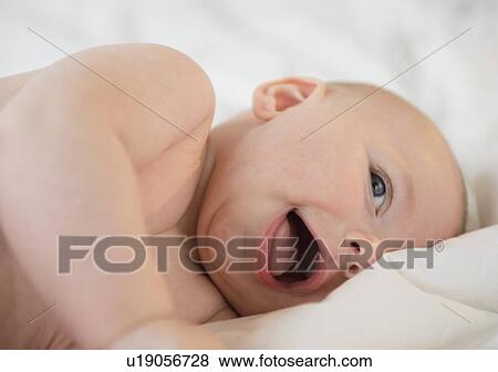 Stock Photo - Baby boy (2-5 months) laughing. Fotosearch