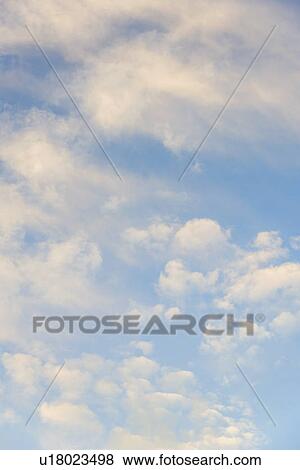 Stock Photo - Blue sky with clouds. Fotosearch