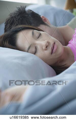 Close up of couple sleeping View Large Photo Image Stock Photography - Close up of couple sleeping. Fotosearch