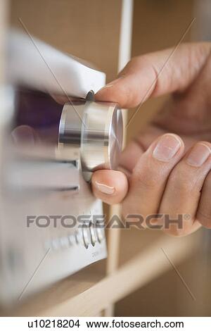 Close-up of hand adjusting audio system View Large Photo Image Picture - Close-up of hand adjusting audio system. Fotosearch