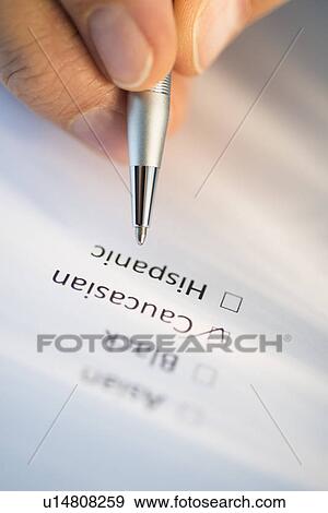 Close-up of hand filling out form View Large Photo Image Stock Photo - Close-up of hand filling out form. Fotosearch
