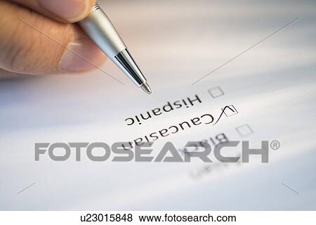Close-up of hand filling out form View Large Photo Image Stock Photo - Close-up of hand filling out form. Fotosearch