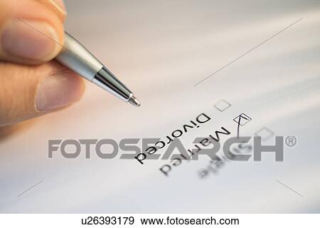 Close-up of hand filling out form View Large Photo Image Stock Photo - Close-up of hand filling out form. Fotosearch