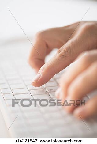 Close-up of hands typing on keyboard View Large Photo Image Stock Photo - Close-up of hands typing on keyboard. Fotosearch