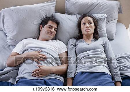 Stock Photograph - Couple in bed. Fotosearch