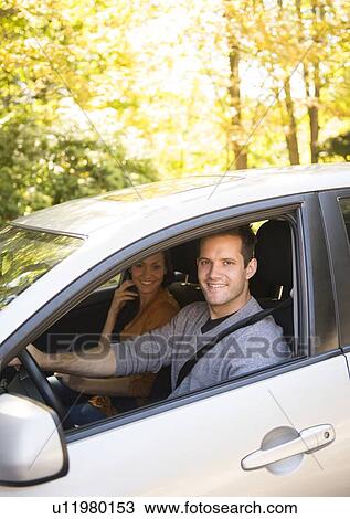 Couple in car View Large Photo Image Stock Image - Couple in car. Fotosearch