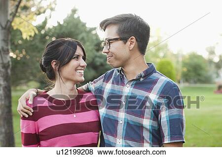Stock Photo - Couple in park. Fotosearch