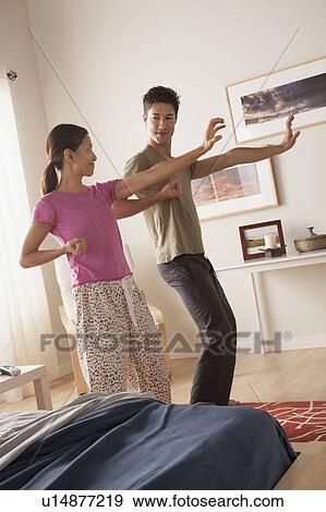 Stock Photo - Couple practicing tai chi. Fotosearch