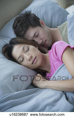 Stock Photo - Couple sleeping. Fotosearch