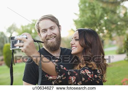Couple taking pictures View Large Photo Image Stock Photo - Couple taking pictures. Fotosearch