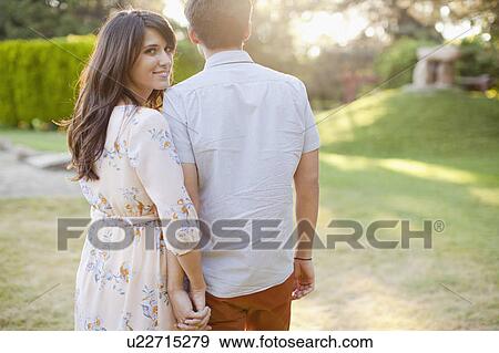Couple walking in park View Large Photo Image Stock Photo - Couple walking in park. Fotosearch