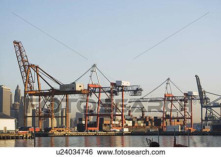 Stock Photograph - Cranes in harbor. Fotosearch