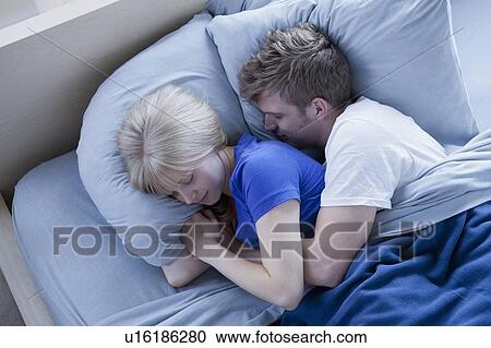 Elevated view of sleeping couple View Large Photo Image Stock Image - Elevated view of sleeping couple. Fotosearch