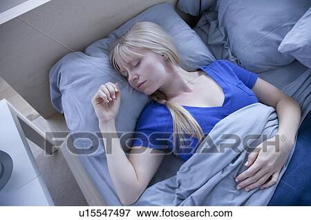 Elevated view of sleeping woman View Large Photo Image Stock Photo - Elevated view of sleeping woman. Fotosearch