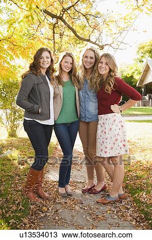 Full length portrait of four friends View Large Photo Image Stock Image - Full length portrait of four friends. Fotosearch