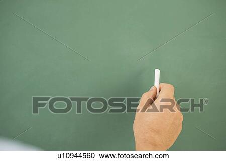 Stock Image - Hand writing on chalkboard. Fotosearch