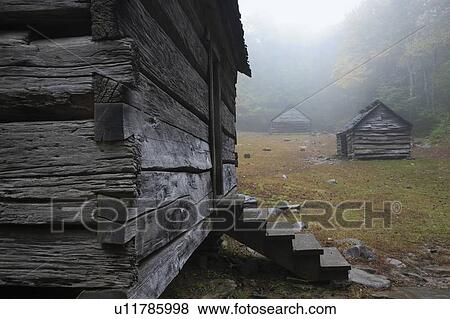 Stock Photo - Huts on meadow. Fotosearch