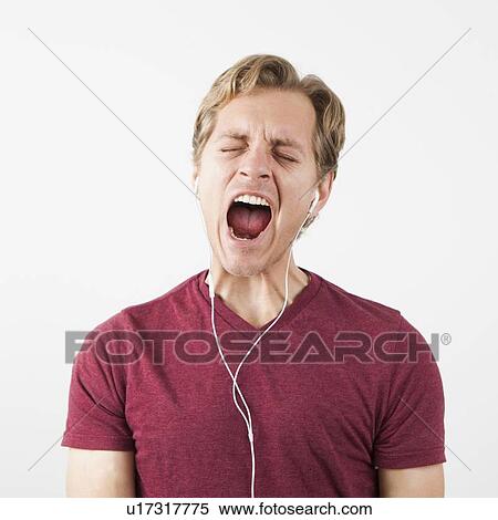 Man singing while listening to music View Large Photo Image Stock Photography - Man singing while listening to music. Fotosearch