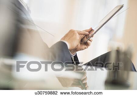 Man using tablet pc View Large Photo Image Stock Image - Man using tablet pc. Fotosearch