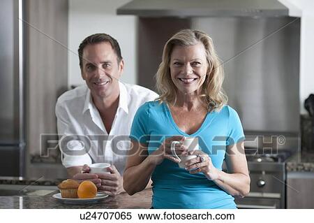Mature couple drinking coffee View Large Photo Image Stock Photography - Mature couple drinking coffee. Fotosearch