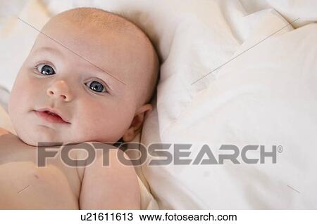 Stock Image - Portrait of baby boy (2-5 months). Fotosearch