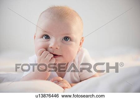Portrait of baby boy (2-5 months) View Large Photo Image Stock Photograph - Portrait of baby boy (2-5 months). Fotosearch