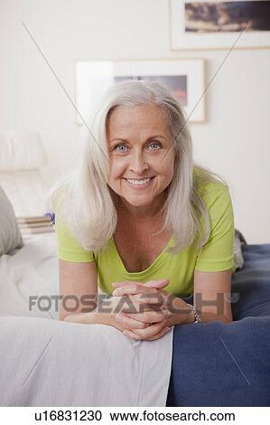Stock Image - Portrait of cheerful senior woman. Fotosearch