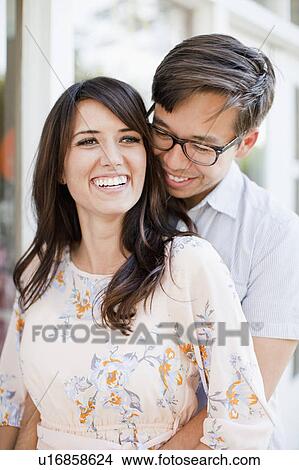 Portrait of couple embracing outdoors View Large Photo Image Picture - Portrait of couple embracing outdoors. Fotosearch