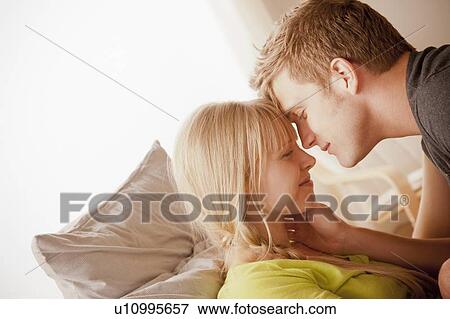 Stock Photo - Portrait of couple face to face. Fotosearch