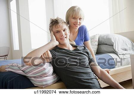 Portrait of couple in bedroom View Large Photo Image Picture - Portrait of couple in bedroom. Fotosearch