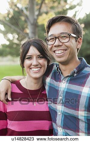Portrait of couple in park View Large Photo Image Stock Image - Portrait of couple in park. Fotosearch