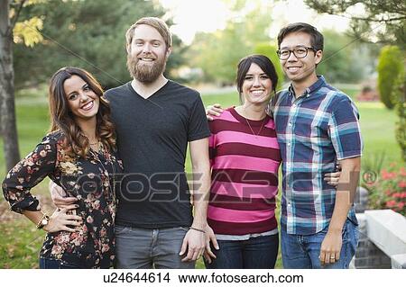Picture - Portrait of group of friends in park. Fotosearch