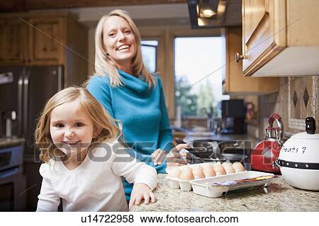Stock Photo - Portrait of happy mother and daughter (4-5). Fotosearch