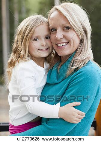 Portrait of happy mother and daughter (4-5) View Large Photo Image Stock Photograph - Portrait of happy mother and daughter (4-5). Fotosearch