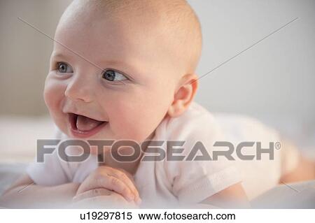 Portrait of laughing baby boy (2-5 months) View Large Photo Image Stock Photography - Portrait of laughing baby boy (2-5 months). Fotosearch