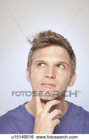 Stock Photograph - Portrait of man contemplating. Fotosearch