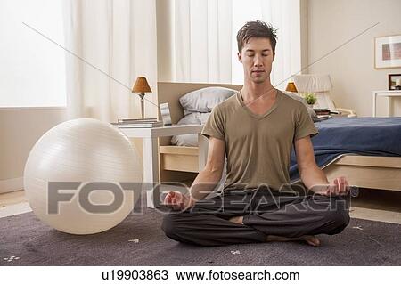 Portrait of man doing yoga View Large Photo Image Stock Image - Portrait of man doing yoga. Fotosearch