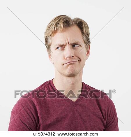 Stock Image - Portrait of man looking away. Fotosearch