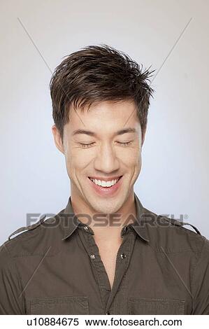 Portrait of man smiling with eyes closed View Large Photo Image Stock Photography - Portrait of man smiling with eyes closed. Fotosearch