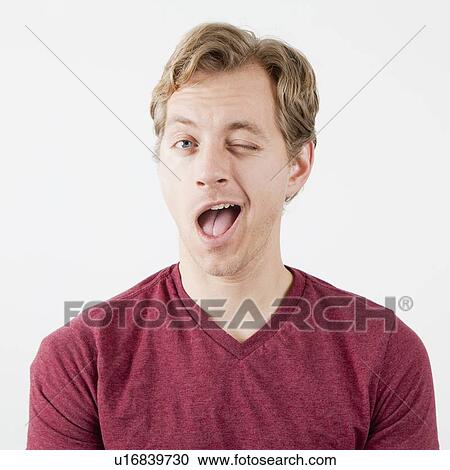 Portrait of man winking View Large Photo Image Stock Image - Portrait of man winking. Fotosearch