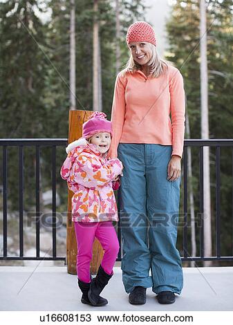 Portrait of mother and daughter (4-5) standing outdoors View Large Photo Image Stock Image - Portrait of mother and daughter (4-5) standing outdoors. Fotosearch