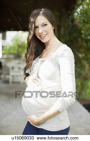 Portrait of pregnant mid adult woman View Large Photo Image Stock Image - Portrait of pregnant mid adult woman. Fotosearch